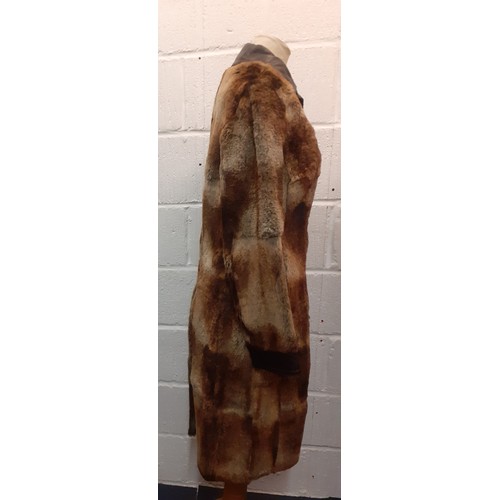 18 - Hugo Boss- A 1980's Press Sample of a brown beaver fur coat with brown leather trim, approx 36