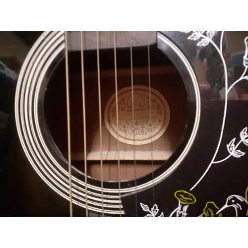 201 - A Hondo acoustic guitar in black serial no: H124BHM with hummingbird design. Location:RWF