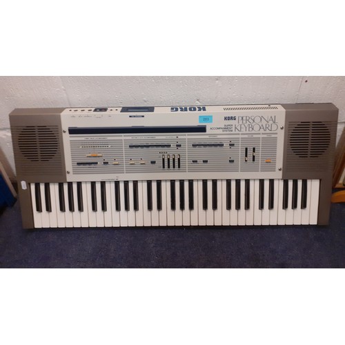 203 - A Korg electric personal keyboard, a super accompaniment system, no leads, serial no:809194. Locatio... 