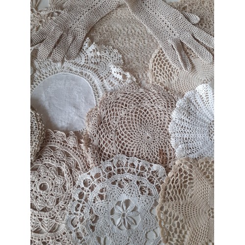 83 - A small quantity of 20th Century crotchet doilies and gloves to include hand and machine made exampl... 