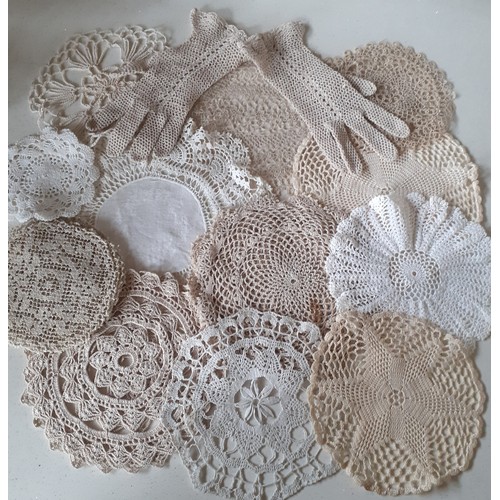 83 - A small quantity of 20th Century crotchet doilies and gloves to include hand and machine made exampl... 