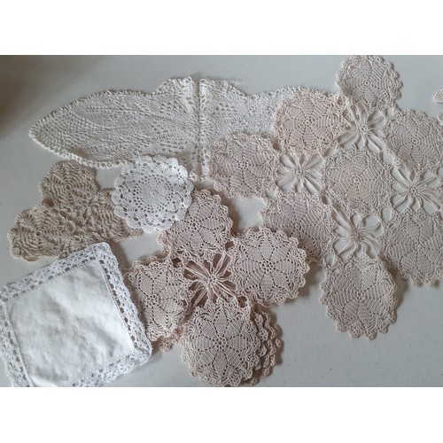 83 - A small quantity of 20th Century crotchet doilies and gloves to include hand and machine made exampl... 