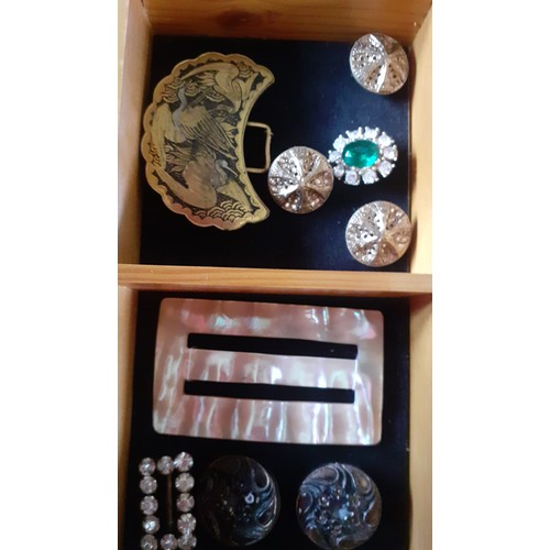 85 - A pine tabletop display case with partitions artistically filled with mounted vintage buttons and bu... 