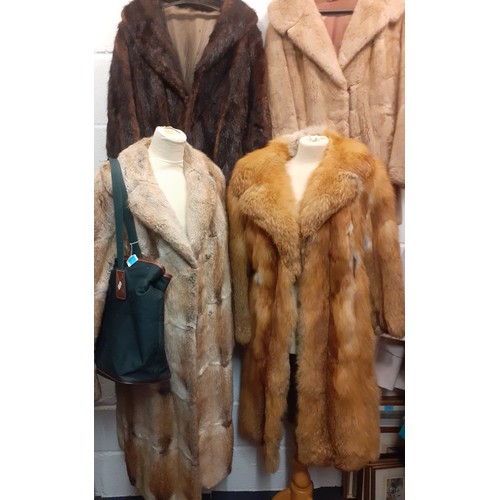 72 - A group of fur coats to include a late 1970's/early 1980's red fox calf length coat A/F with shawl c... 