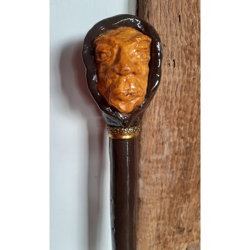 238 - A reproduction of Inspector Abbeline's walking stick with a handle fashioned as a hooded gents head ... 