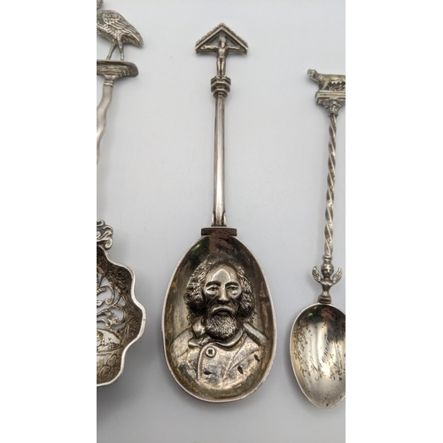 17 - Silver to include a silver spoon hallmarked London 1893, with an embossed bowl decorated with a bear... 
