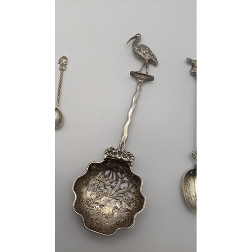 17 - Silver to include a silver spoon hallmarked London 1893, with an embossed bowl decorated with a bear... 