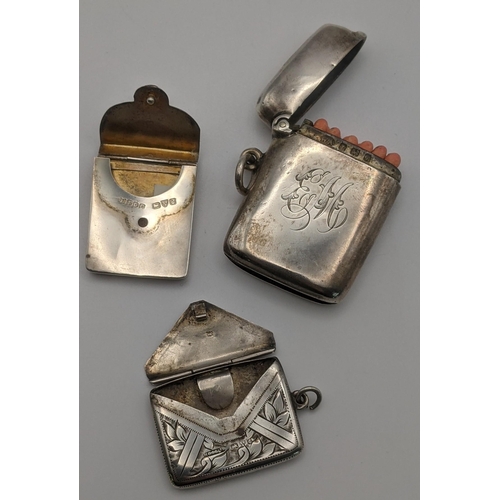 19 - Silver to include a vesta case hallmarked Birmingham 1908, together with a two stamp holders one fas... 