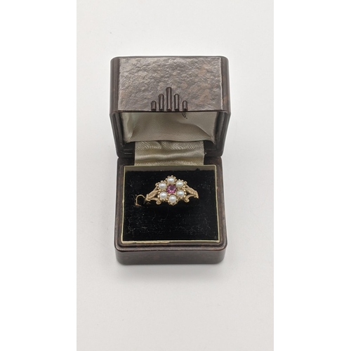 7 - A 9ct gold ruby and pearl daisy ring 1.8g, size 'O'.
Location: CAB 3
If there is no condition report... 