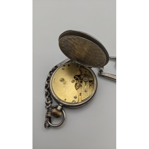 71 - A silver open faced keyless pocket watch with a silver pocket watch chain, with a bulldog clip and t... 