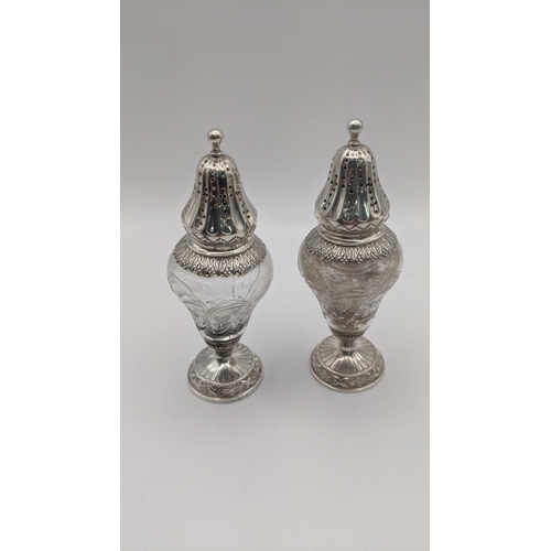 79 - An early 19th century silver lidded mustard pot with a blue glass liner and spoon, along with a pair... 