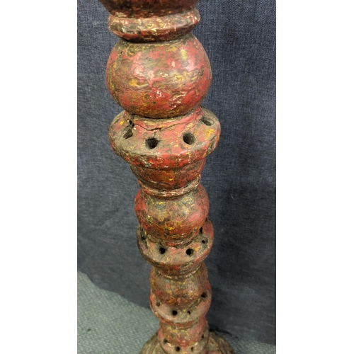 168 - Two 19th century Indian items to include a carved candle stand, 95cm h together with a carved candle... 