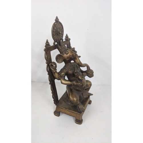 173 - A bronze Ganesha statue seated on a chair, 32cm h
Location: 3-1
If there is no condition report show... 