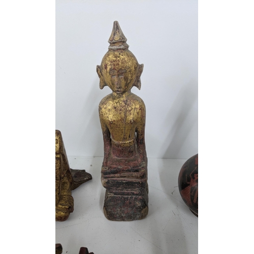 177 - A mixed lot of treen carved figures to include a gilt painted Buddha and others
Location:7.2
If ther... 