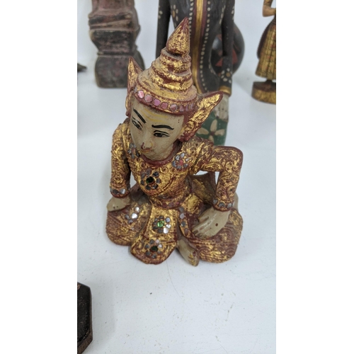 177 - A mixed lot of treen carved figures to include a gilt painted Buddha and others
Location:7.2
If ther... 