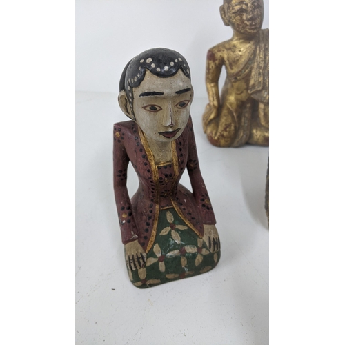 177 - A mixed lot of treen carved figures to include a gilt painted Buddha and others
Location:7.2
If ther... 