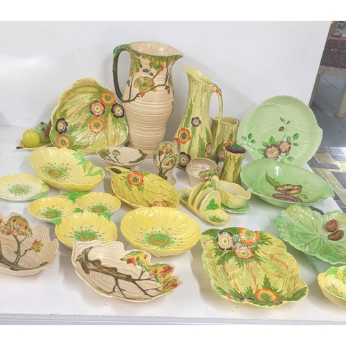 237 - Carlton ware to include an oak tree ribbed jug and others, together with Art Deco yellow floral jug,... 