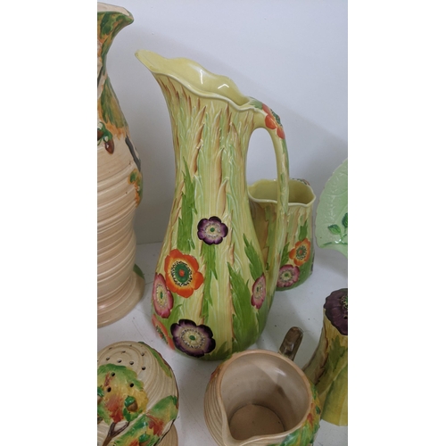 237 - Carlton ware to include an oak tree ribbed jug and others, together with Art Deco yellow floral jug,... 