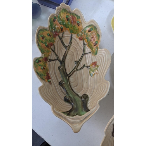 237 - Carlton ware to include an oak tree ribbed jug and others, together with Art Deco yellow floral jug,... 