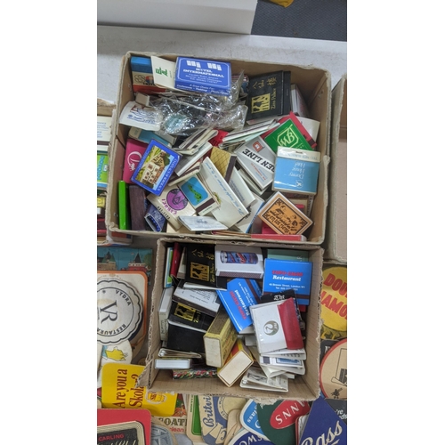 311 - A quantity of vintage matchboxes and beer coasters to include Bass, Heineken, Carling and others Loc... 