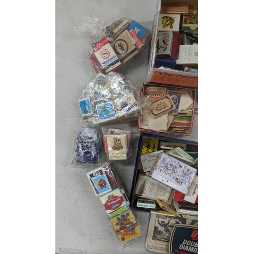 311 - A quantity of vintage matchboxes and beer coasters to include Bass, Heineken, Carling and others Loc... 