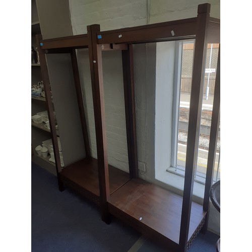 90 - A pair of Hudson Living mahogany stained hardwood clothes rails. Location:RWB