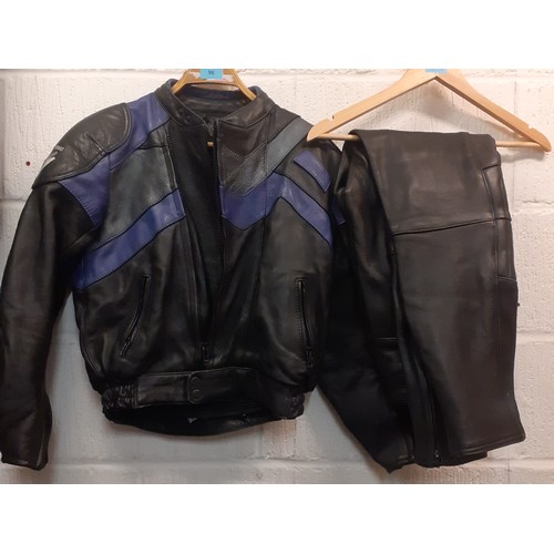 96 - A Frank Thomas ladies motorbike jacket and Ashman trousers, UK size 10 in black with blue chevron de... 