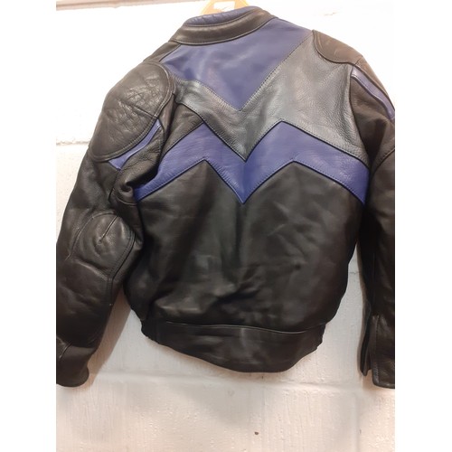 96 - A Frank Thomas ladies motorbike jacket and Ashman trousers, UK size 10 in black with blue chevron de... 