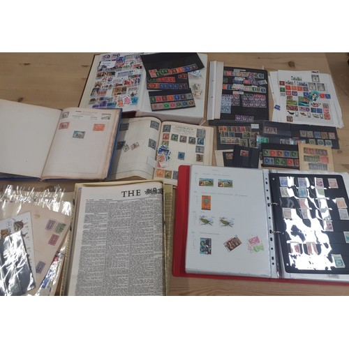 236 - A vintage stamp collection containing worldwide stamps together with a 1953 reproduction newspaper. ... 