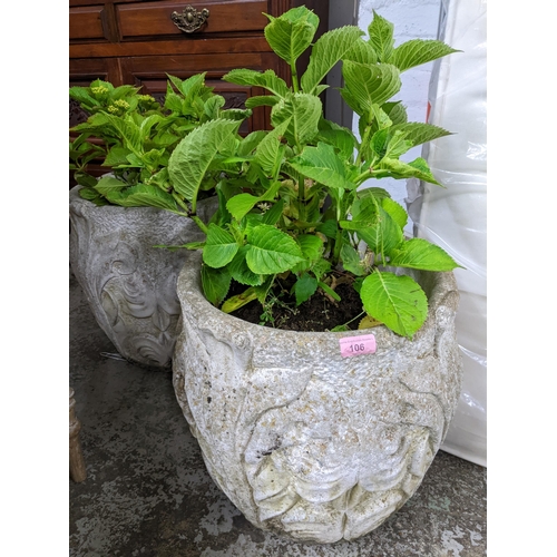 106 - A group of five weathered garden stoneware pots with raised floral decoration, each containing a Hyd... 