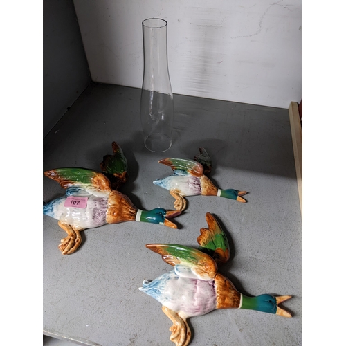 107 - A lot to include three Beswick flying ducks wall pockets, 596/1,2,3 and a glass smoke funnel Locatio... 