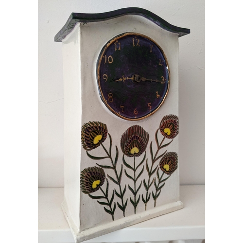 109 - Nina Deschamps - a French studio pottery mantel clock, purple and mottled green dial with gilt paint... 