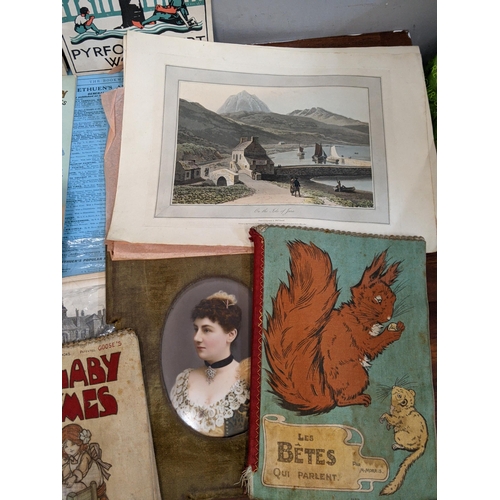 11 - Books and printed ephemera to include two children's books printed on cloth, the motor journal bookl... 