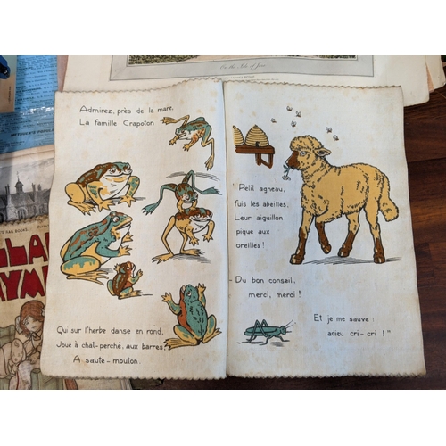 11 - Books and printed ephemera to include two children's books printed on cloth, the motor journal bookl... 