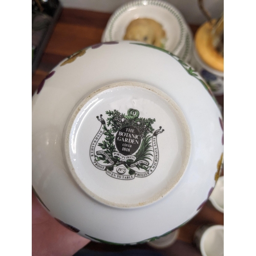 12 - Mixed china to include a commemorative ware, a part Portmerion dinner service and models of cats and... 