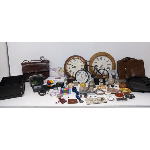 125 - A mixed lot to include wall clocks, Amazon Kindle, silver plated cigarette box, Zefer brown leather ... 