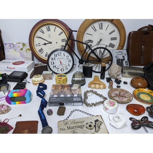 125 - A mixed lot to include wall clocks, Amazon Kindle, silver plated cigarette box, Zefer brown leather ... 