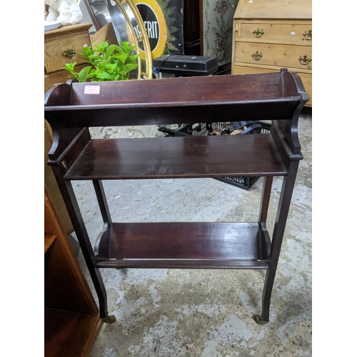 129 - A group of three Edwardian and later mahogany bookshelves, a five shelf oak open bookcase Location: ... 