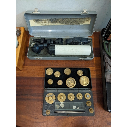 13 - Medicinal equipment to include microscope and a mid century blood pressure machine, weights and a st... 