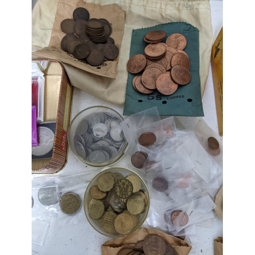 154 - A quantity of mainly British 20th century coinage to include Elizabeth II sixpences, various pennies... 