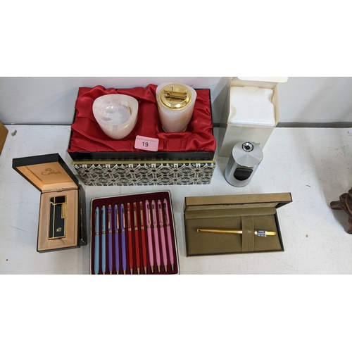 19 - Cigarette and related items and pens to include a Colibri lighter and matching ashtray, a Colibri li... 