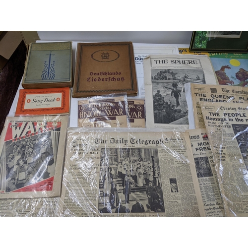 255 - A collection of books and vintage newspapers to include editions of the Daily Telegraph and Evening ... 