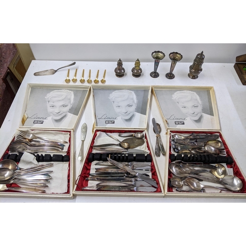 27 - Mixed silver plate and flatware to include two candlesticks, sugar caster, gold coloured coffee spoo... 