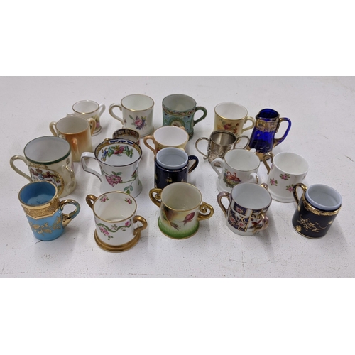 280 - Nineteen miniature cups, some twin some tri handled to include examples from Royal Worcester, Royal ... 