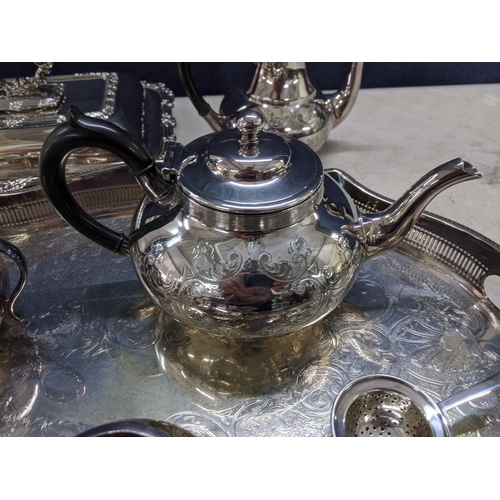 285 - Silver and silver plate to include a coffee pot, teapot lidded tureen, a large tray a silver tea str... 