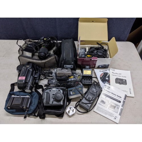 286 - Cameras and photographic accessories to include an Canon Powershot G5, a Kodak DC265 zoom camera, a ... 