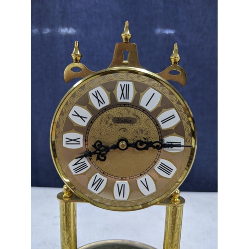 288 - A mid/late 20th century Haller 400 day anniversary clock faced with an ornately decorated Roman dial... 