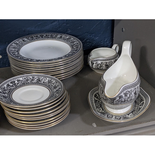 293 - A Wedgwood Florentine pattern part dinner service to include three oval meat dishes, a gravy boat an... 