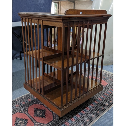 294 - An Early 20th century walnut two tier revolving bookcase with a galleried back
Location:A2M
If there... 