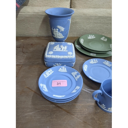 31 - Wedgwood Jasper stoneware to include cup, saucers, and plates, a vase and other items
Location: LAB
... 